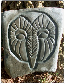 stone engraving of an owl
